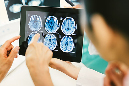 2353-pointing-at-an-xray-on-a-tablet.jpg