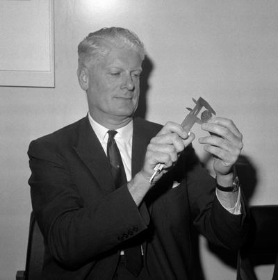 Figure 3: Mr Conway measuring a new 50p coin in 1968 © PA Images| Alamy Stock Photo