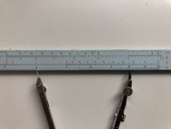 Figure 4: The pair of compasses from Figure 3 placed so the left-hand point is at 4.