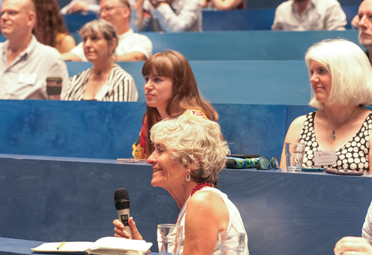 IMA Past President Celia Hoyles asks Hannah a question from audience