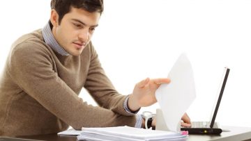Taking decisions, not risks Man sat at desk