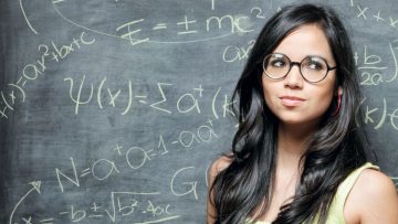 Woman in front of blackboard
