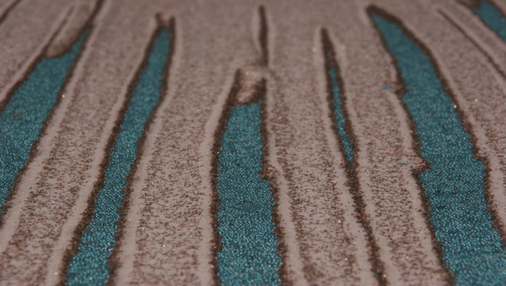 A series of leveed fingers that have been triggered by a segregation induced instability.