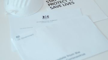 Face mask and stay at home advice leaflet