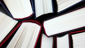 Hardback books viewed from above.