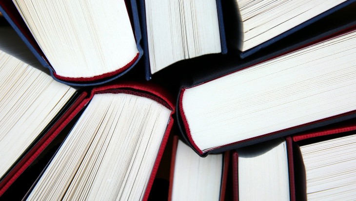 Hardback books viewed from above.