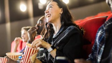 Could Mathematics Be Big at the Box Office? Friends are watching a movie in the cinema with popcorn. People sit in the armchairs of the cinema and look at the screen © Kseniia Zatevakhina | Dreamstime.com