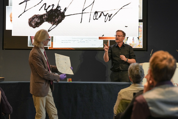 Brady presents his attempt at a signature with help from archivist Keith