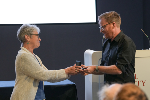 Brady receives the his Medal from Zeeman’s daughter, Nicolette