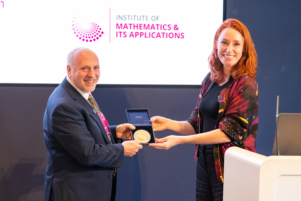 The IMA president presents David with his medal, astarstudios.tv