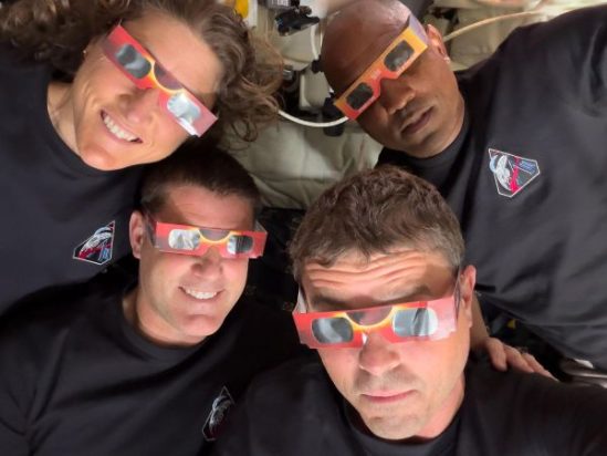The Artemis II crew during a solar eclipse on their lunar flyby